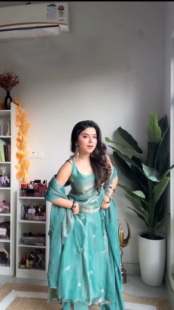 "Elegant Fandy Silk Ensemble with Thread & Sequence Work"